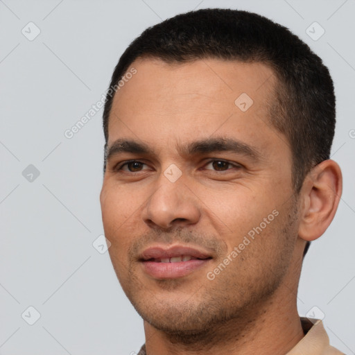 Joyful white young-adult male with short  black hair and brown eyes