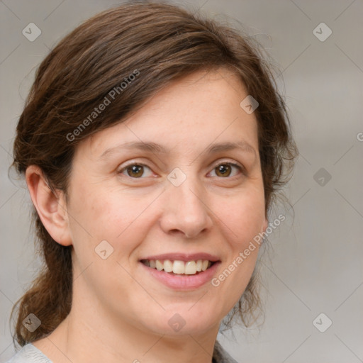 Joyful white adult female with medium  brown hair and grey eyes