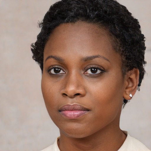 Neutral black young-adult female with short  brown hair and brown eyes