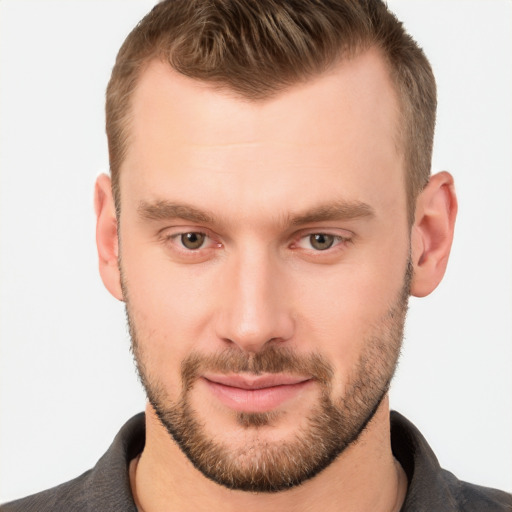 Joyful white young-adult male with short  brown hair and brown eyes