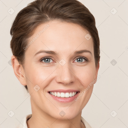 Joyful white young-adult female with short  brown hair and grey eyes