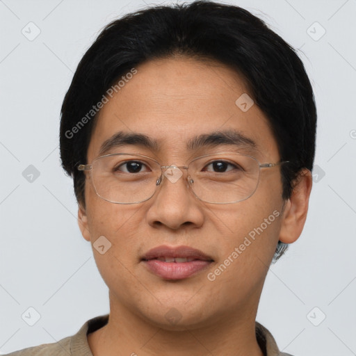 Joyful asian adult male with short  brown hair and brown eyes