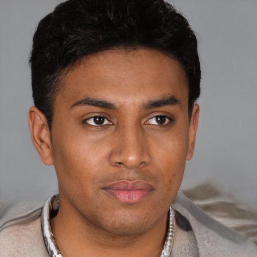 Neutral latino young-adult male with short  brown hair and brown eyes