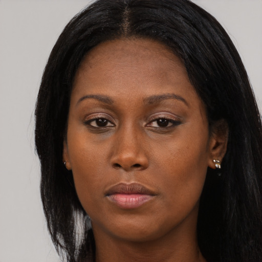 Neutral black young-adult female with long  black hair and brown eyes