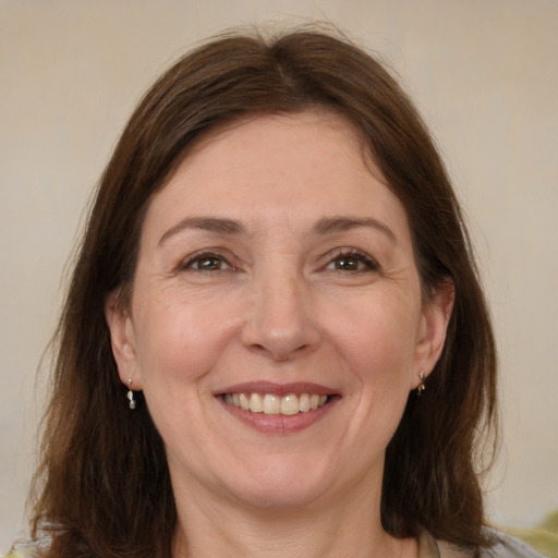 Joyful white adult female with medium  brown hair and brown eyes