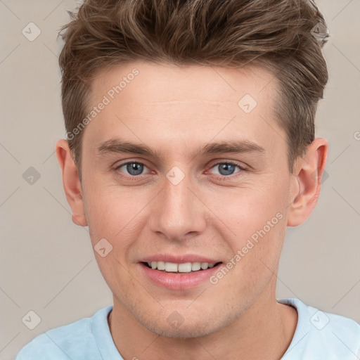 Joyful white young-adult male with short  brown hair and grey eyes