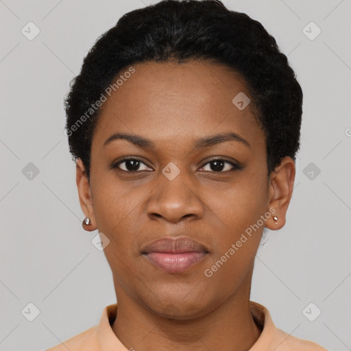 Joyful black young-adult female with short  black hair and brown eyes