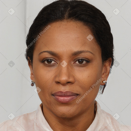 Joyful black adult female with short  brown hair and brown eyes