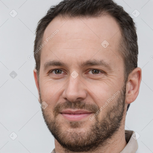 Joyful white adult male with short  brown hair and brown eyes