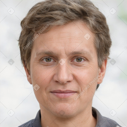 Joyful white adult male with short  brown hair and grey eyes