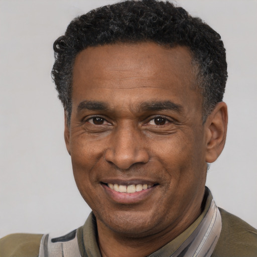 Joyful latino adult male with short  black hair and brown eyes