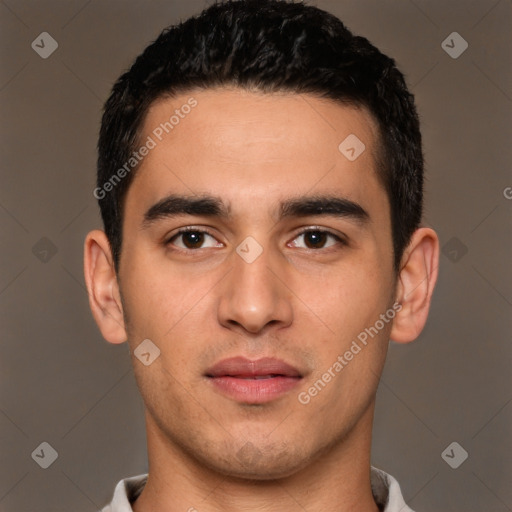 Joyful white young-adult male with short  black hair and brown eyes