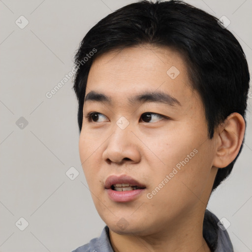 Neutral asian young-adult male with short  black hair and brown eyes