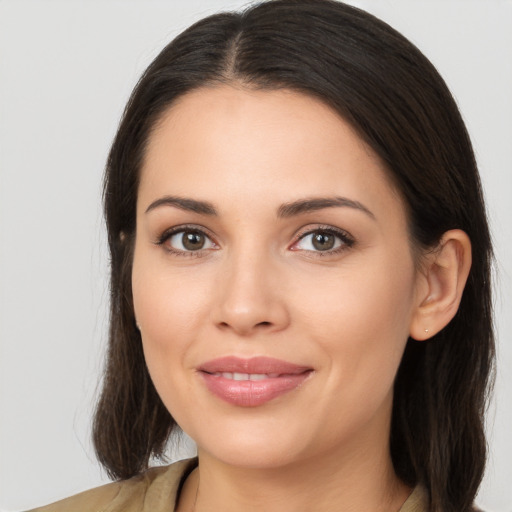 Joyful white young-adult female with medium  brown hair and brown eyes