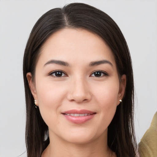 Joyful white young-adult female with long  brown hair and brown eyes