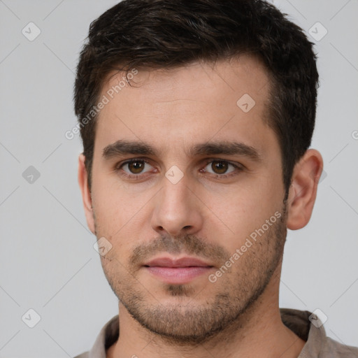 Neutral white young-adult male with short  brown hair and brown eyes