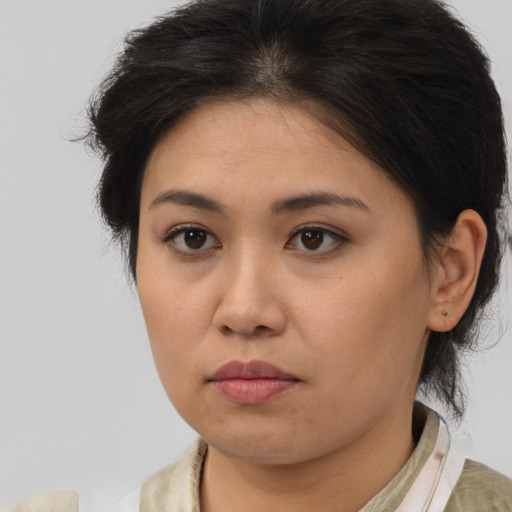 Neutral asian young-adult female with medium  brown hair and brown eyes