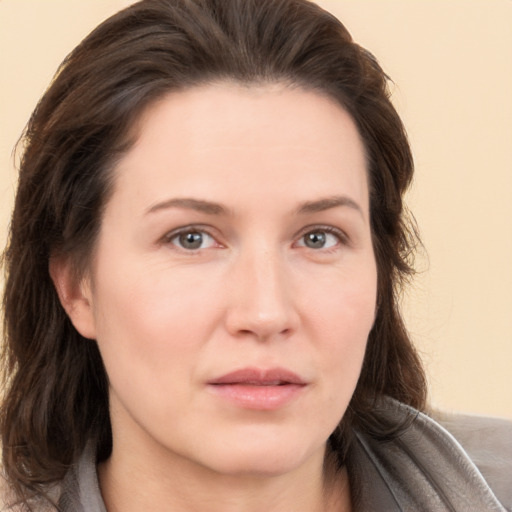 Neutral white young-adult female with medium  brown hair and brown eyes