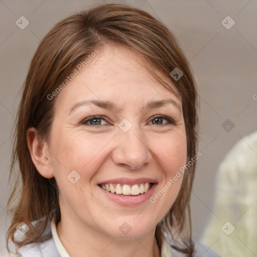 Joyful white adult female with medium  brown hair and grey eyes