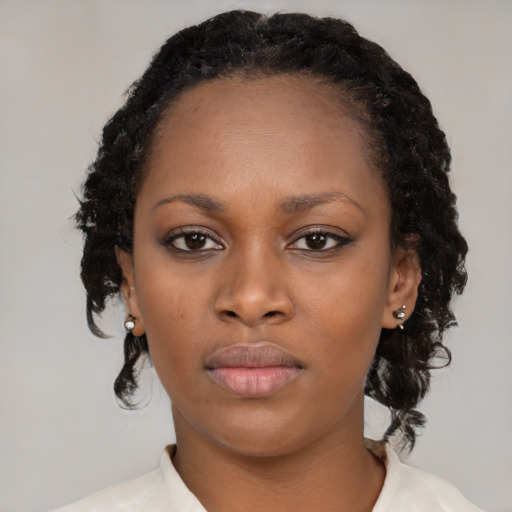 Neutral black young-adult female with medium  black hair and brown eyes