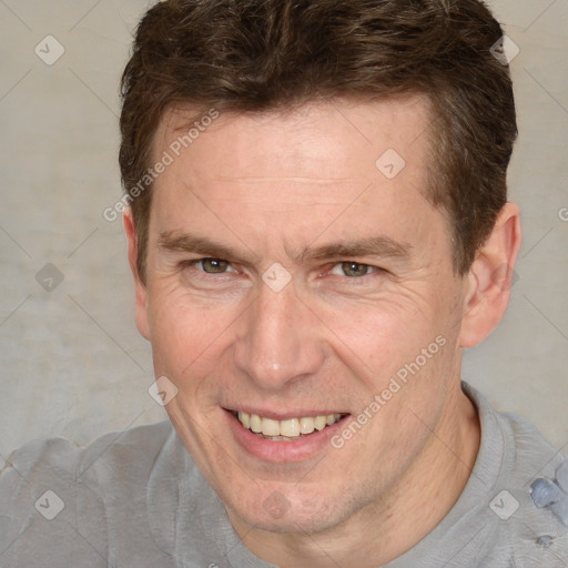 Joyful white adult male with short  brown hair and grey eyes