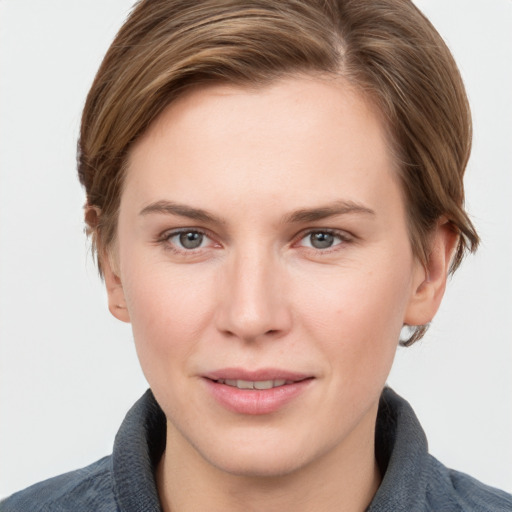 Joyful white young-adult female with medium  brown hair and grey eyes