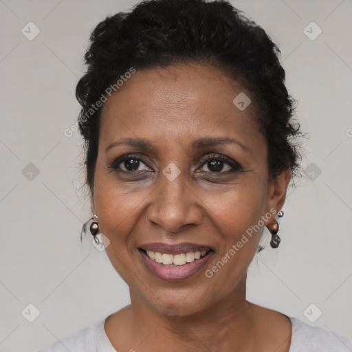 Joyful black adult female with short  brown hair and brown eyes