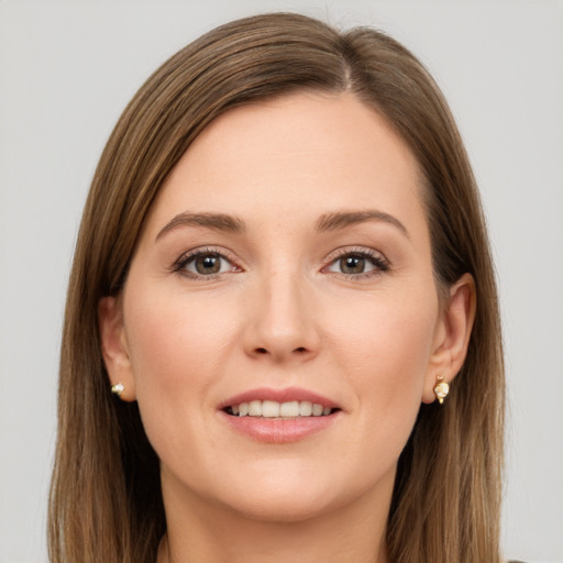 Joyful white young-adult female with long  brown hair and brown eyes