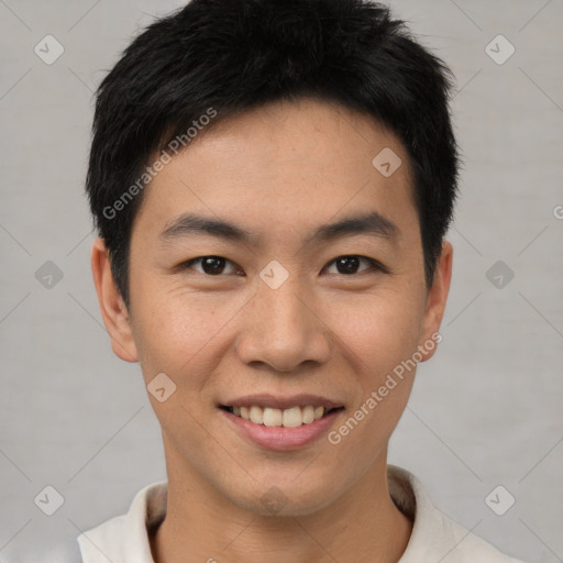 Joyful asian young-adult male with short  black hair and brown eyes