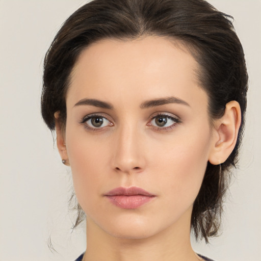 Neutral white young-adult female with medium  brown hair and brown eyes