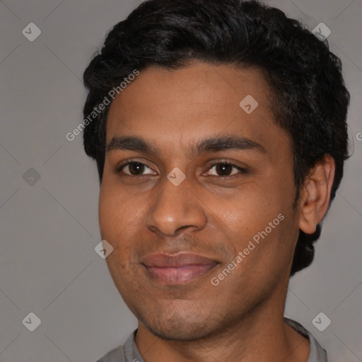 Joyful black young-adult male with short  black hair and brown eyes