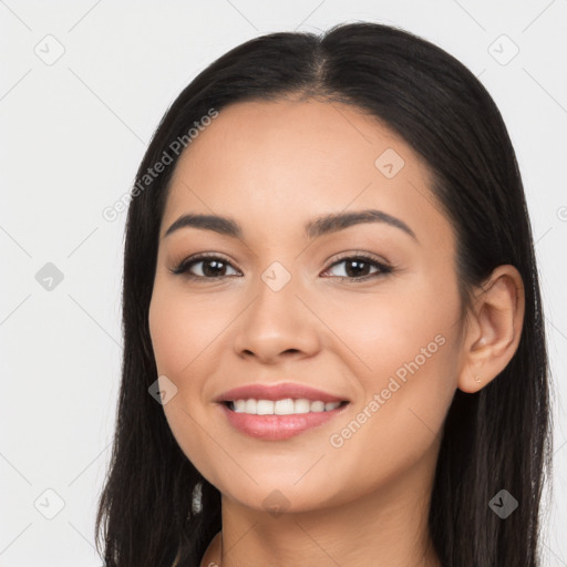 Joyful latino young-adult female with long  black hair and brown eyes