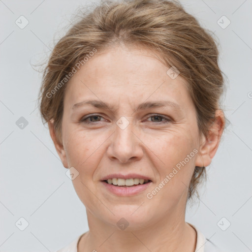 Joyful white adult female with short  brown hair and grey eyes