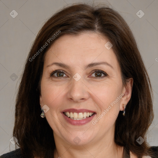 Joyful white adult female with medium  brown hair and brown eyes