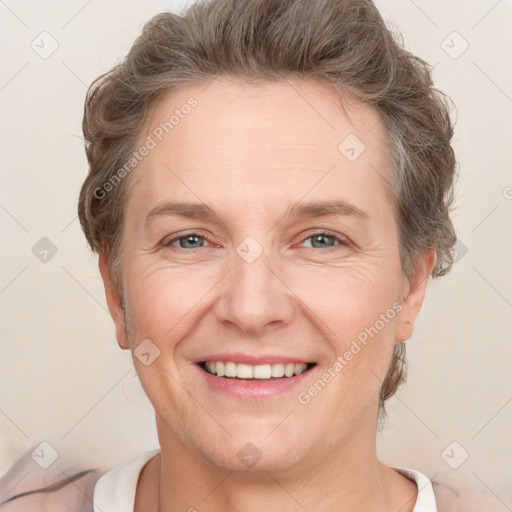 Joyful white adult female with short  brown hair and brown eyes