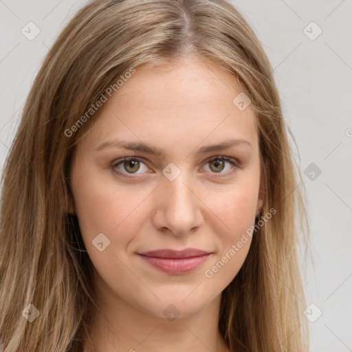 Joyful white young-adult female with long  brown hair and green eyes