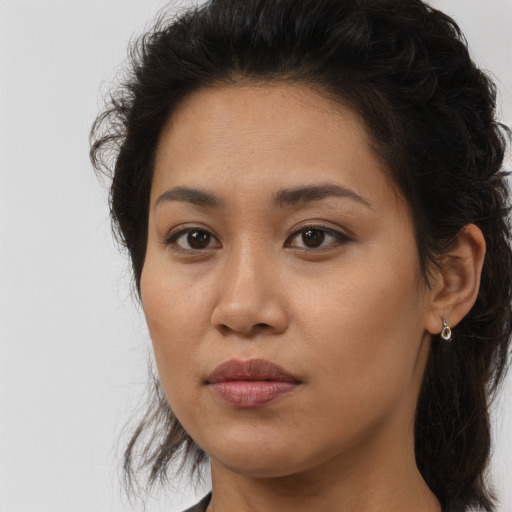 Joyful asian young-adult female with long  brown hair and brown eyes