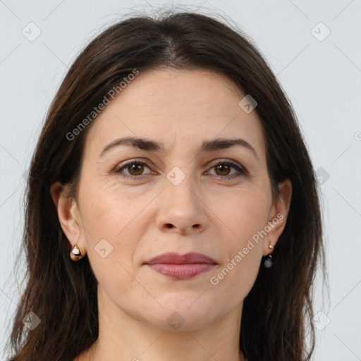 Joyful white adult female with long  brown hair and brown eyes