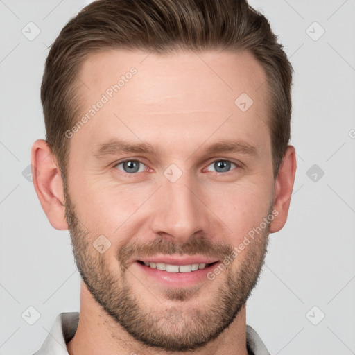 Joyful white young-adult male with short  brown hair and grey eyes