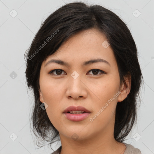 Joyful asian young-adult female with medium  black hair and brown eyes