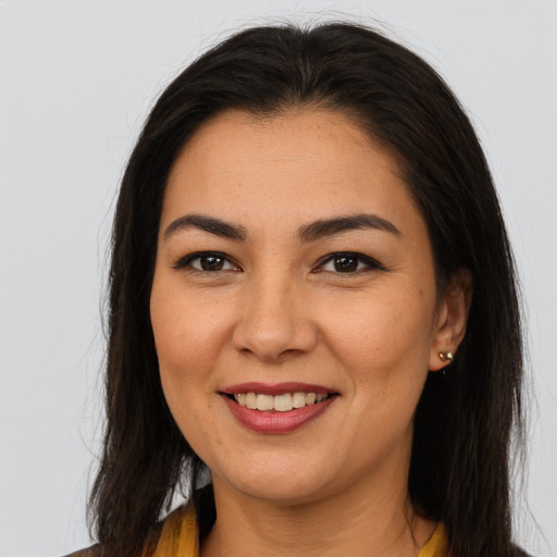 Joyful asian young-adult female with long  brown hair and brown eyes