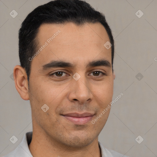 Joyful latino young-adult male with short  brown hair and brown eyes