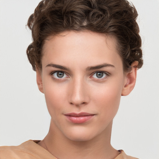 Neutral white young-adult female with short  brown hair and brown eyes