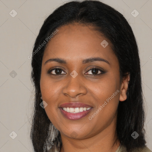 Joyful black young-adult female with long  black hair and brown eyes