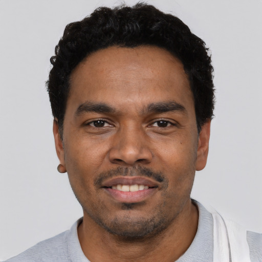 Neutral black young-adult male with short  black hair and brown eyes