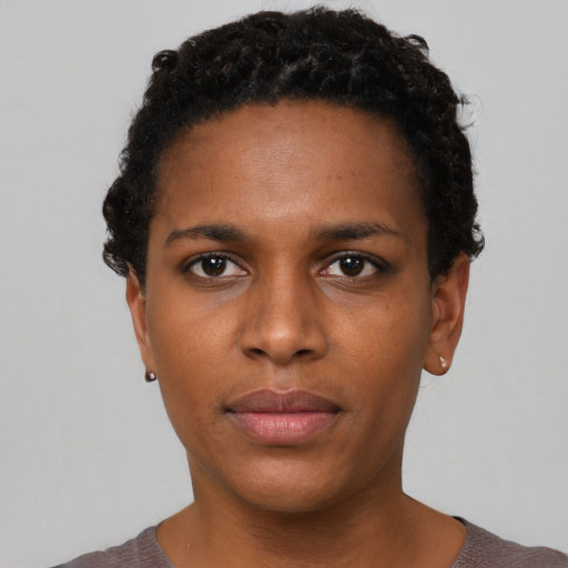 Neutral latino young-adult female with short  brown hair and brown eyes