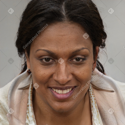 Joyful black adult female with medium  brown hair and brown eyes