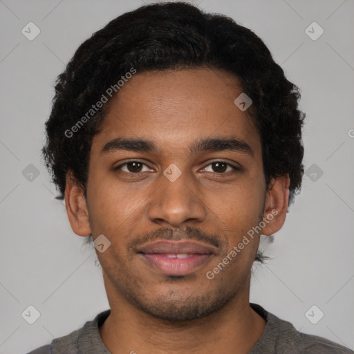 Joyful black young-adult male with short  brown hair and brown eyes