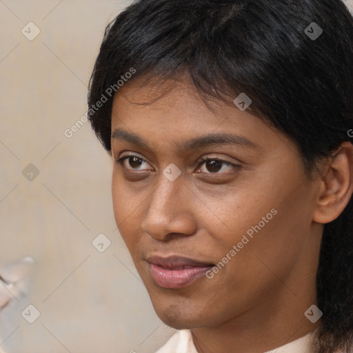 Neutral black young-adult female with short  brown hair and brown eyes