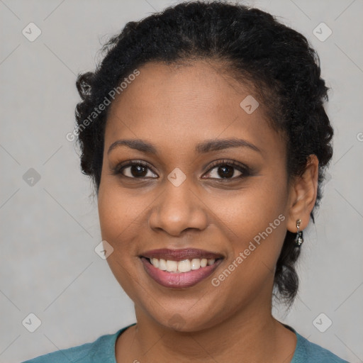 Joyful black young-adult female with short  brown hair and brown eyes